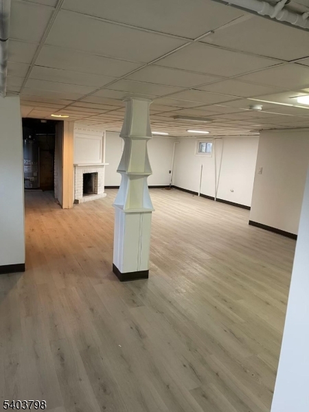 8 Fairview Avenue Secaucus, NJ 07094 - Photo 11 of 16 a view of empty room with wooden floor