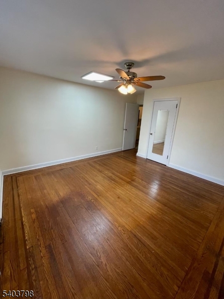 8 Fairview Avenue Secaucus, NJ 07094 - Photo 12 of 16 wooden floor in an empty room with a window