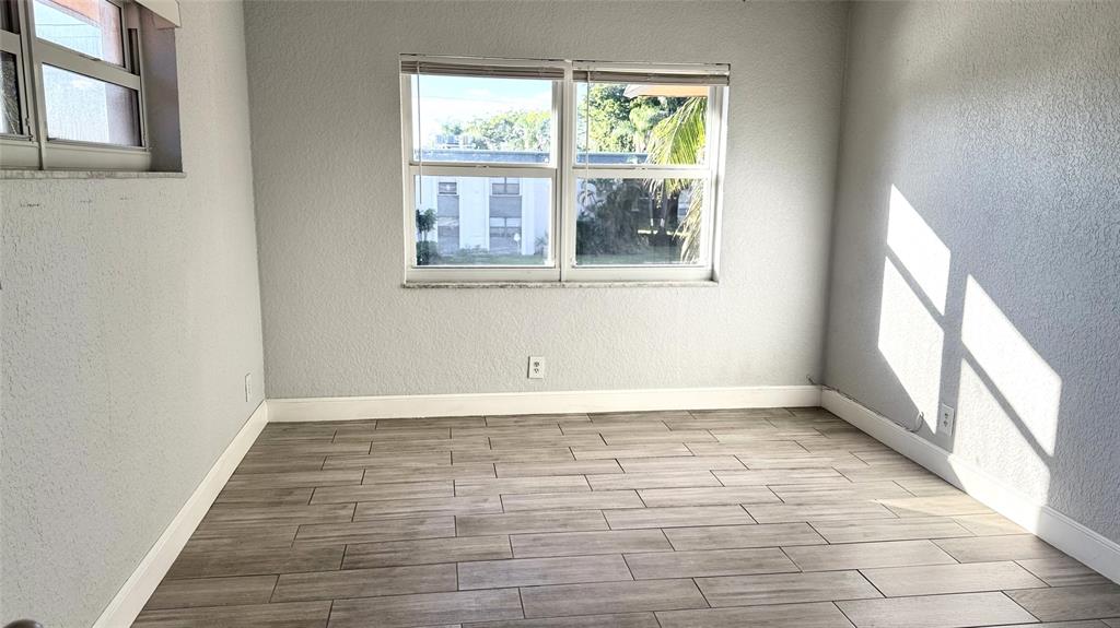 770 Southeast 2nd Avenue, Unit A207 Deerfield Beach, FL 33441 - Photo 12 of 27 a view of an empty room with a window
