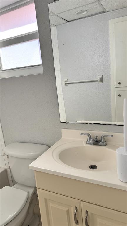 770 Southeast 2nd Avenue, Unit A207 Deerfield Beach, FL 33441 - Photo 14 of 27 a bathroom with a sink and a toilet