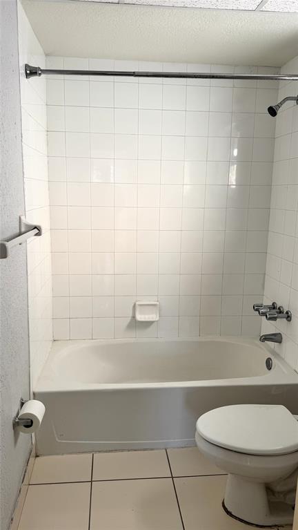770 Southeast 2nd Avenue, Unit A207 Deerfield Beach, FL 33441 - Photo 15 of 27 a bathroom with a toilet and a shower
