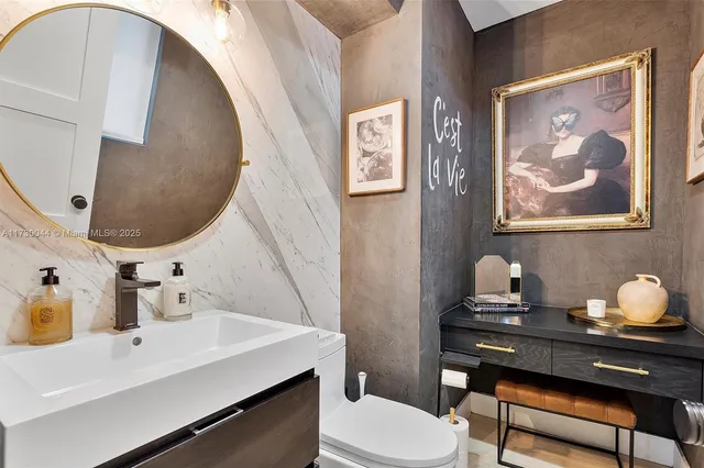 a bedroom with bed and a chandelier