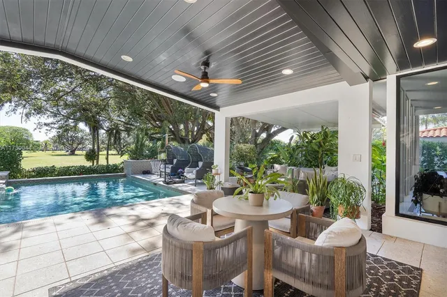 a view of a patio with couches chairs and a patio