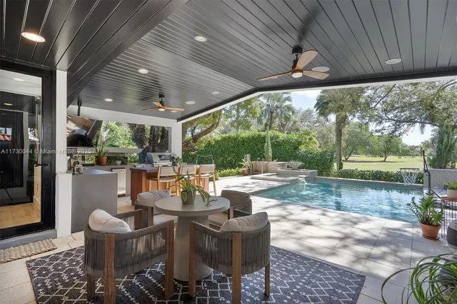 a view of a park with sitting area