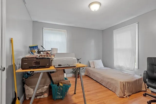 a bedroom with a bed and a table in it