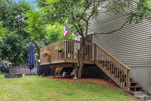 a view of a house with backyard and porch