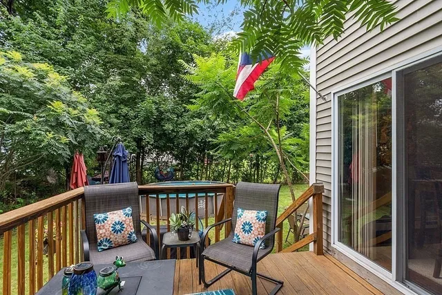 a view of a balcony with furniture