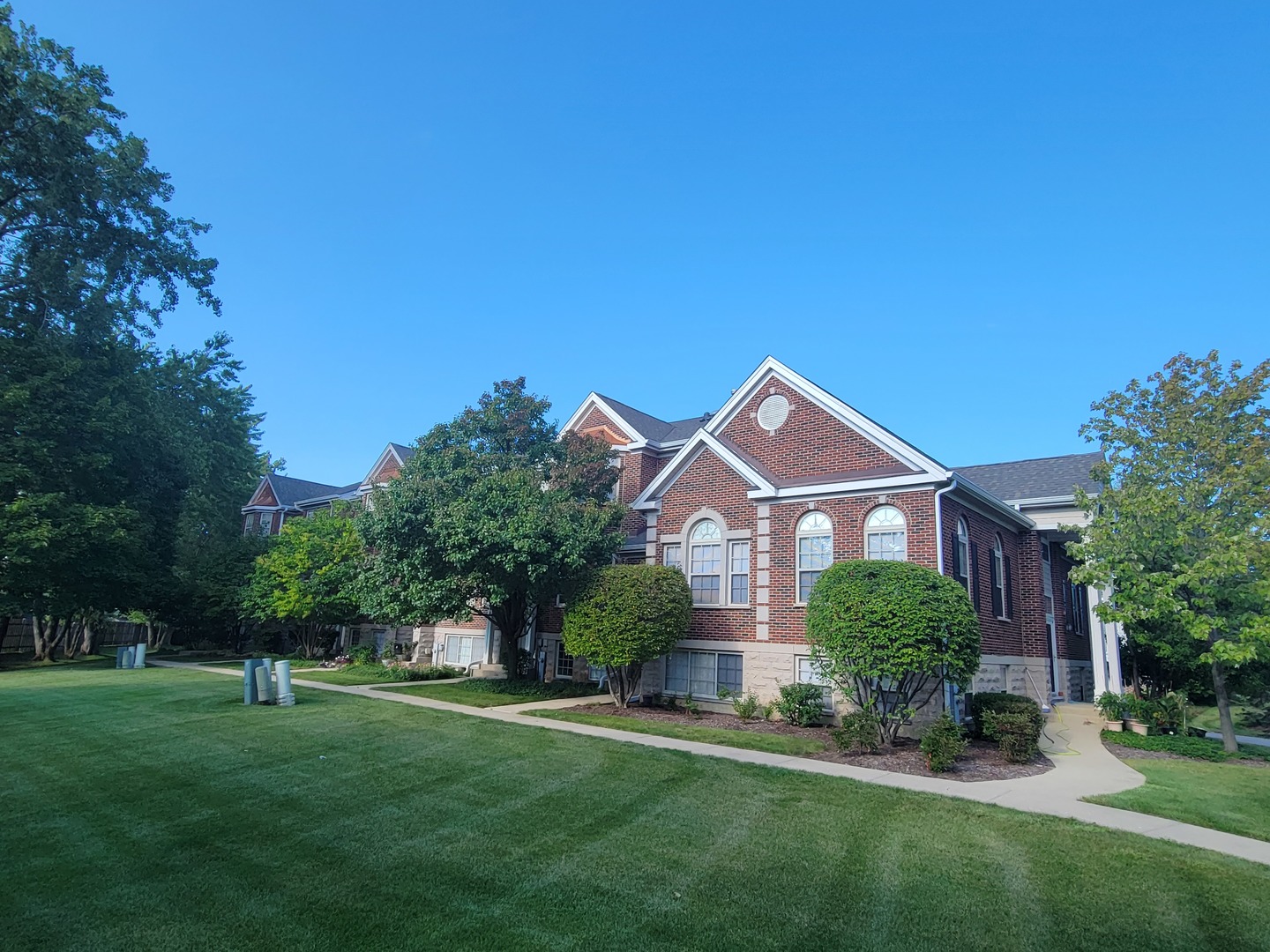 442 Prestwick Lane Wheeling, IL 60090 - Photo 2 of 4 a front view of a house with a yard