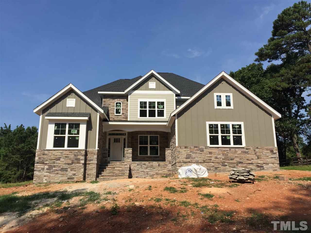 2016 Bowling Green Trail Raleigh, NC 27613 - Photo 1 of 20 a front view of a house with a yard
