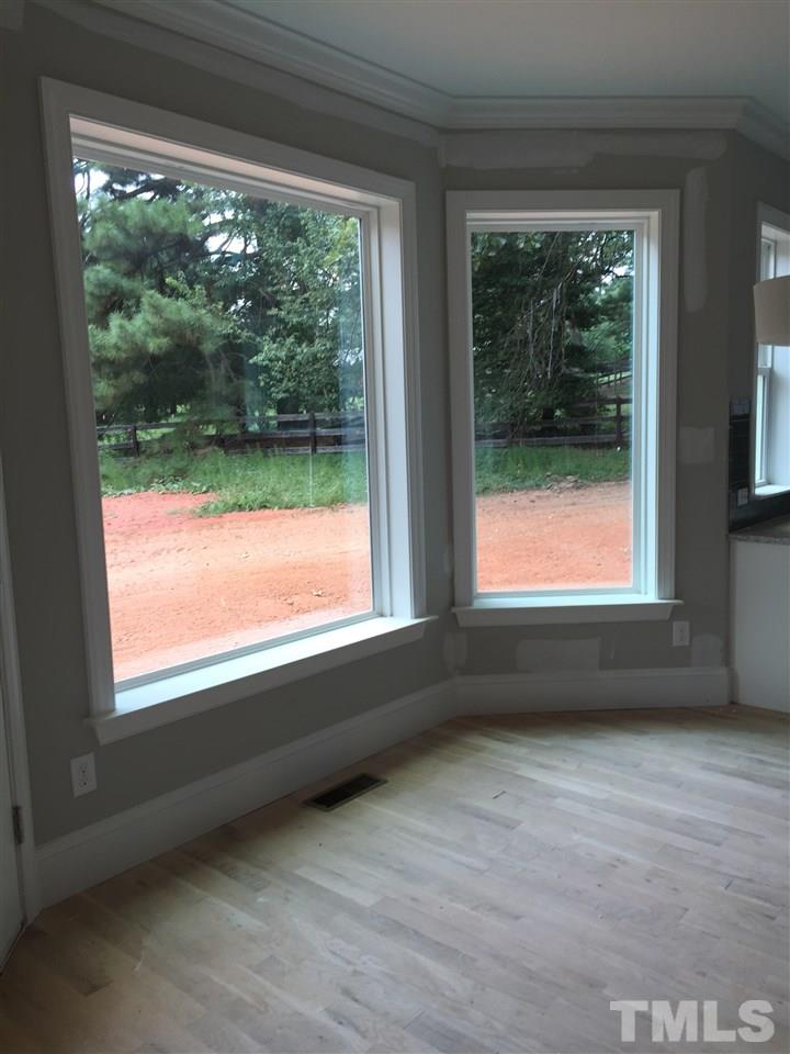 2016 Bowling Green Trail Raleigh, NC 27613 - Photo 5 of 20 a view of an empty room with a window