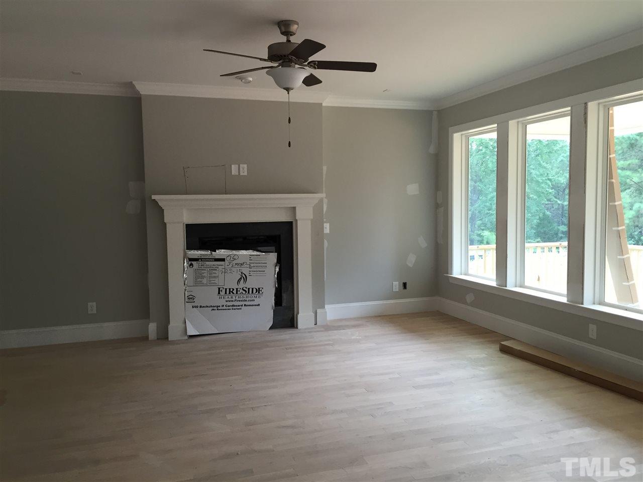 2016 Bowling Green Trail Raleigh, NC 27613 - Photo 7 of 20 a living room with a fireplace in it