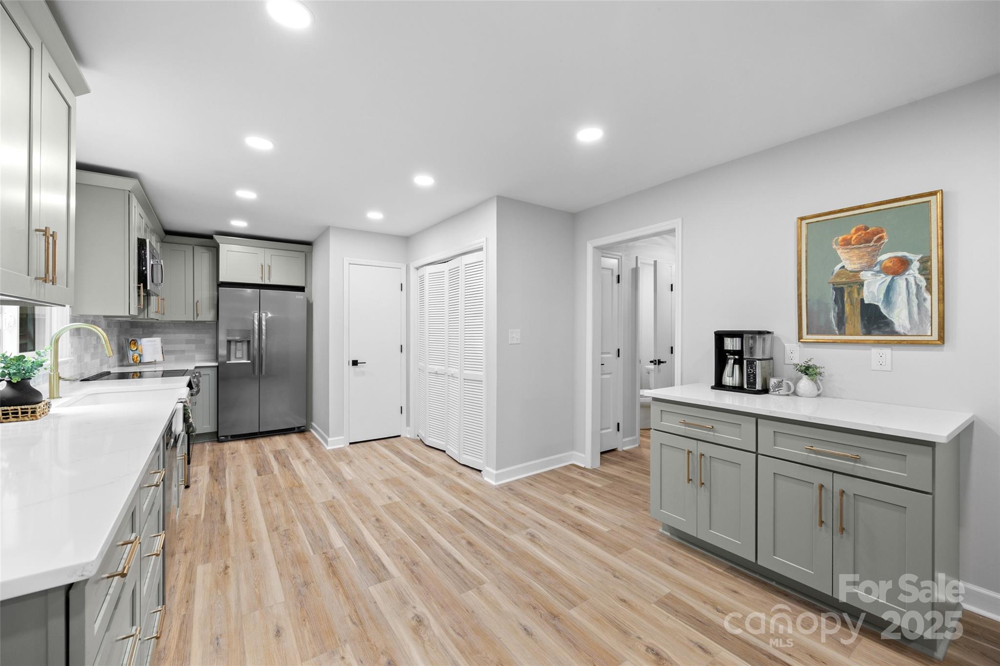 7301 Timber Ridge Drive Mint Hill, NC 28227 - Photo 11 of 37 a large kitchen with a lot of counter space and wooden floor