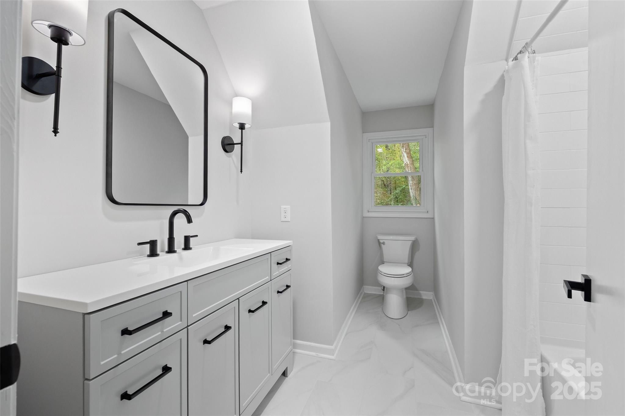 7301 Timber Ridge Drive Mint Hill, NC 28227 - Photo 20 of 37 a bathroom with a toilet sink and mirror