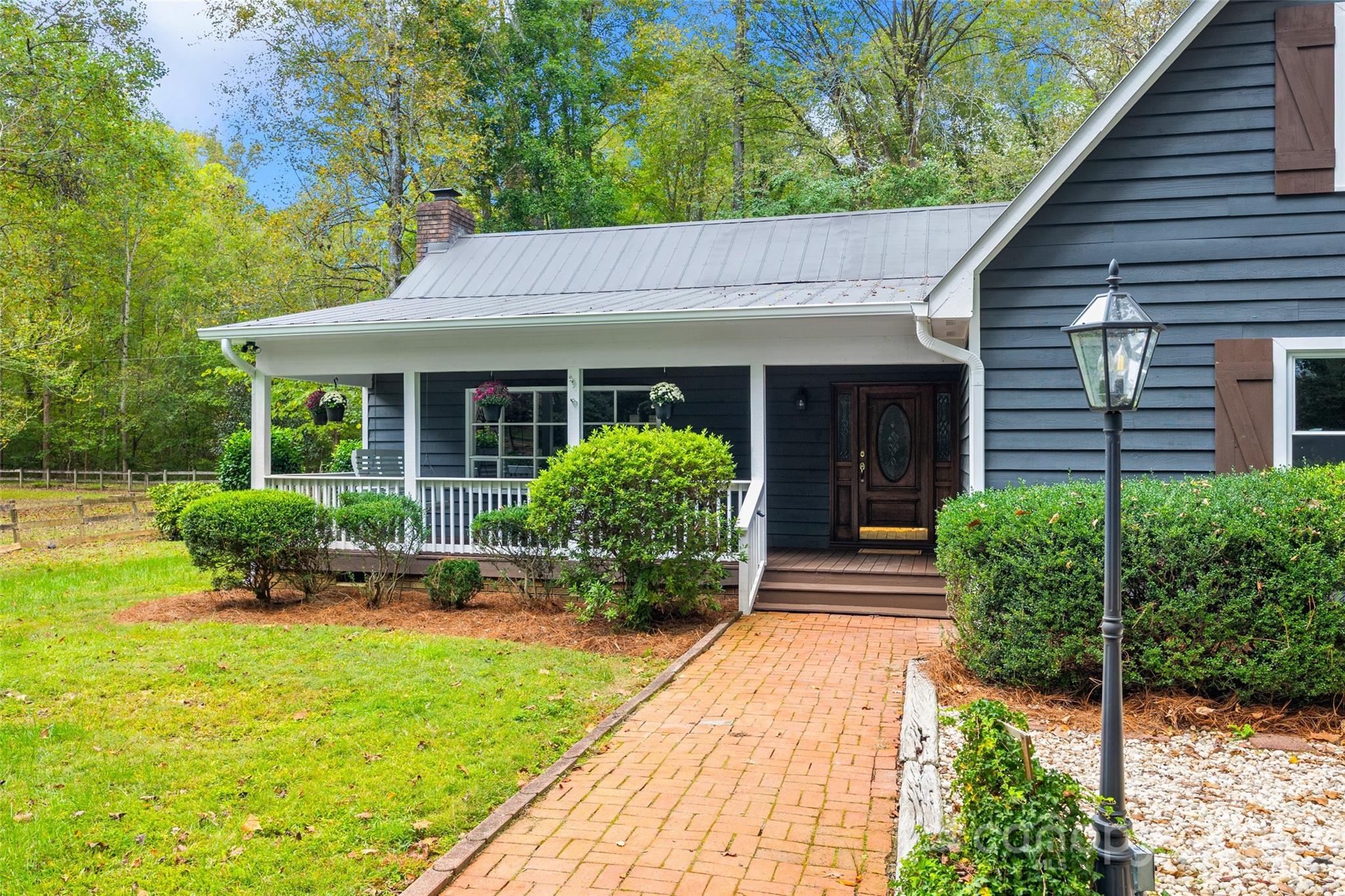 7301 Timber Ridge Drive Mint Hill, NC 28227 - Photo 2 of 37 a front view of a house with garden