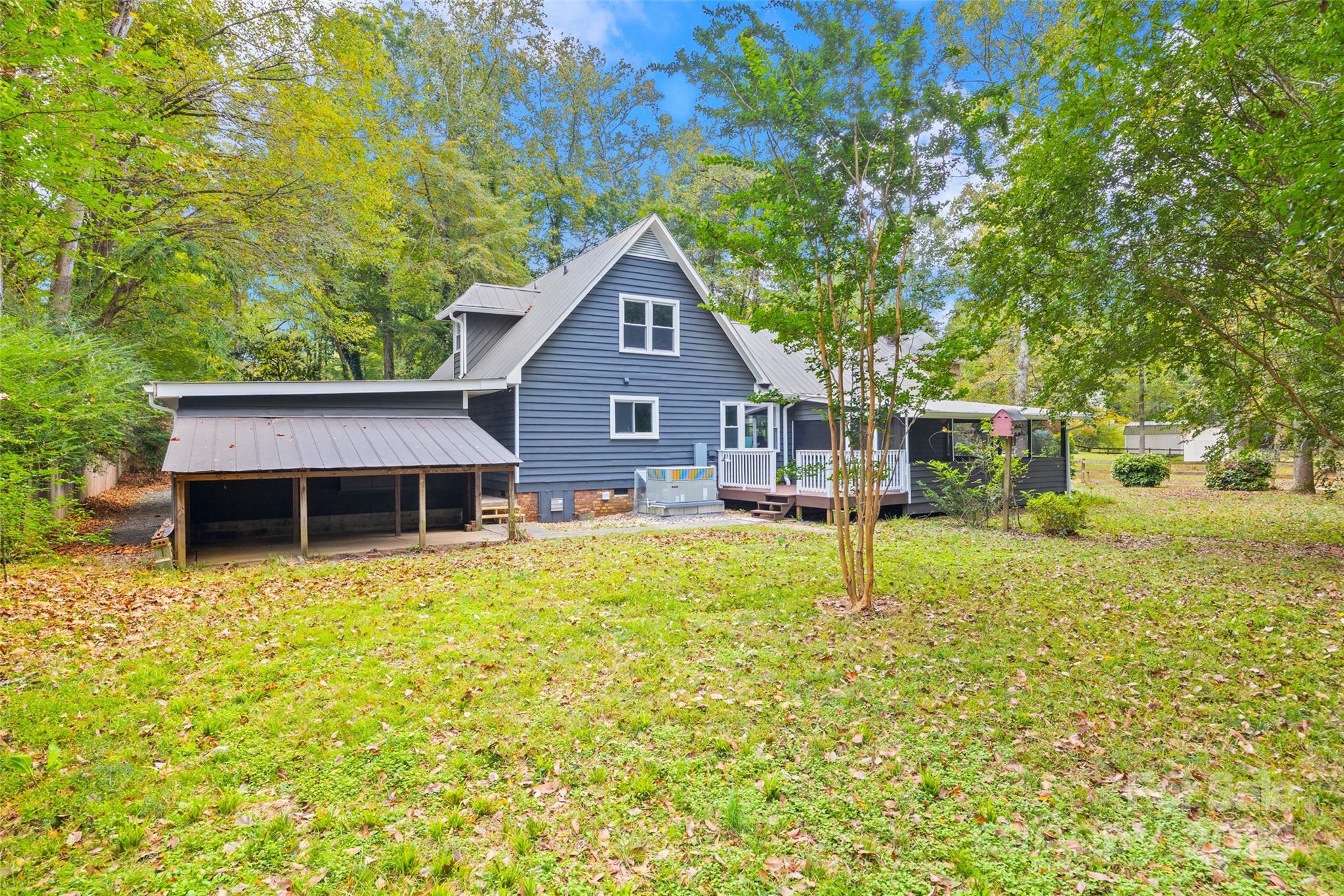 7301 Timber Ridge Drive Mint Hill, NC 28227 - Photo 27 of 37 a house that has a tree in front of it