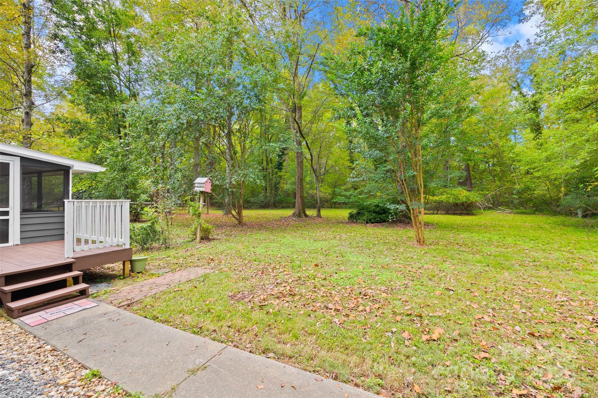 7301 Timber Ridge Drive Mint Hill, NC 28227 - Photo 29 of 37 a backyard of a house with lots of green space