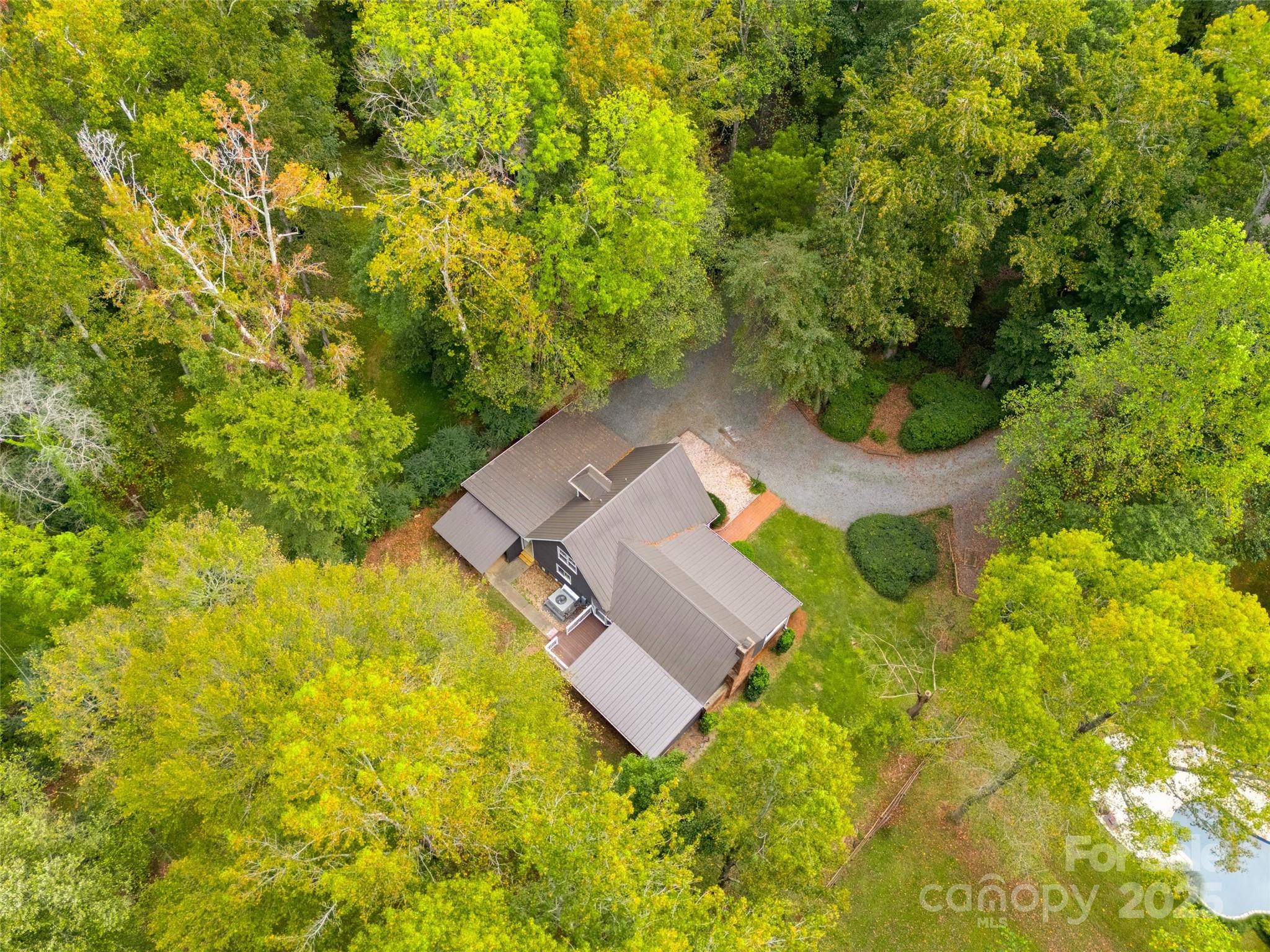 7301 Timber Ridge Drive Mint Hill, NC 28227 - Photo 36 of 37 an aerial view of residential house with swimming pool and green space