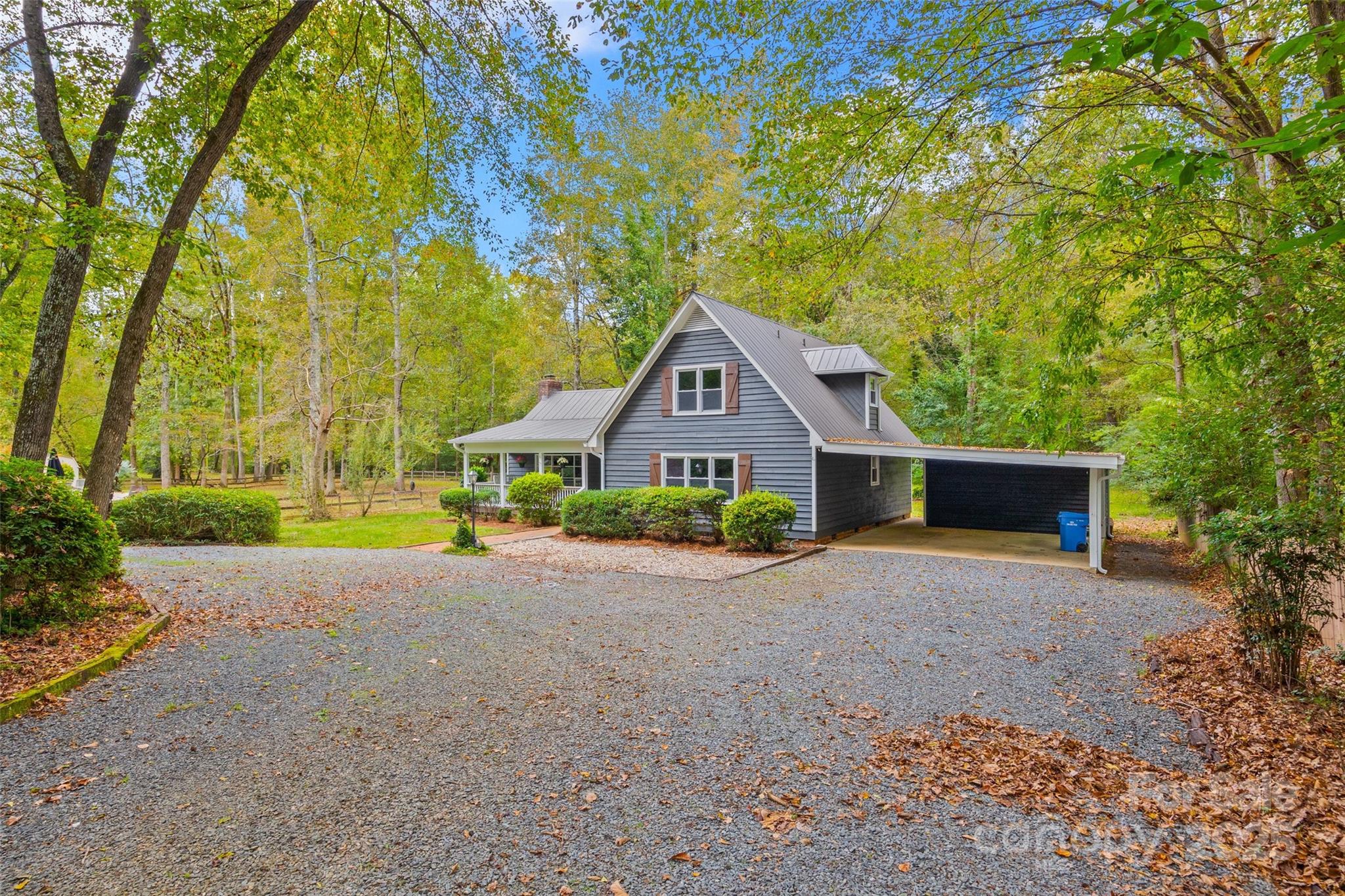 7301 Timber Ridge Drive Mint Hill, NC 28227 - Photo 37 of 37 a front view of house with yard and trees in the background