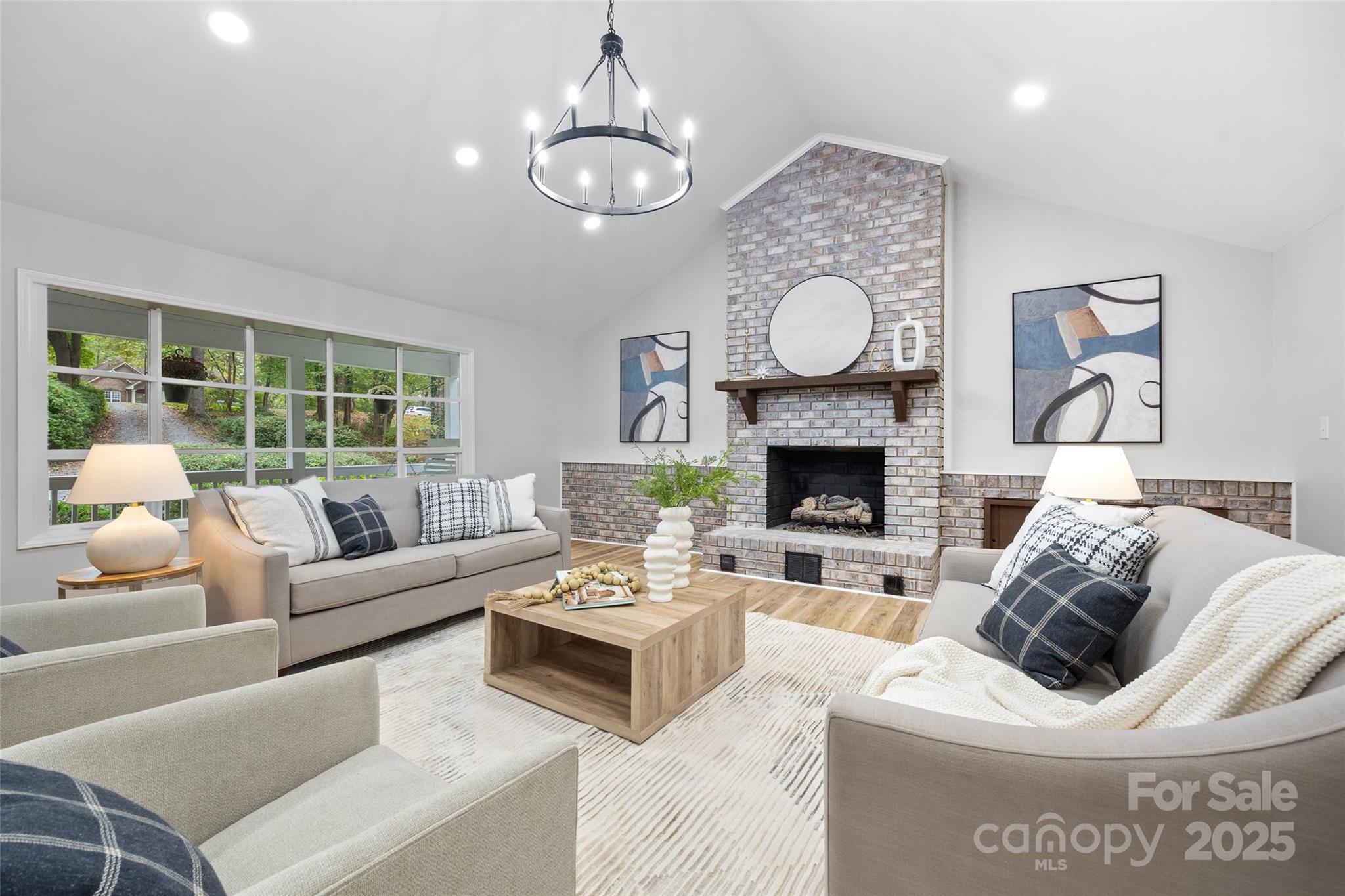 7301 Timber Ridge Drive Mint Hill, NC 28227 - Photo 6 of 37 a living room with furniture a fireplace and a large window