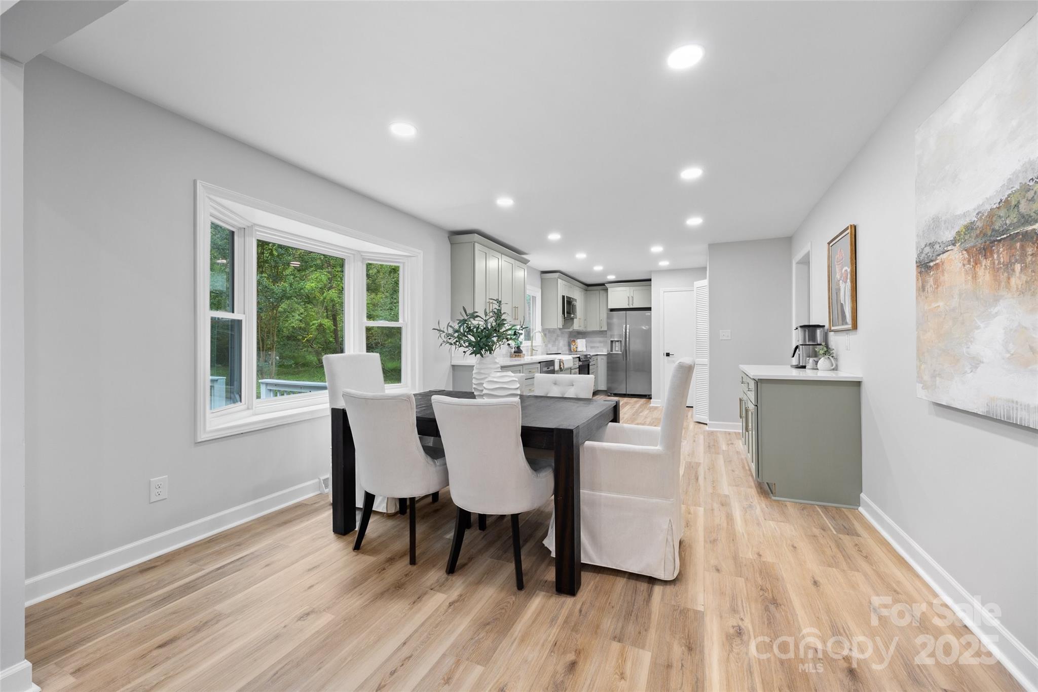 7301 Timber Ridge Drive Mint Hill, NC 28227 - Photo 9 of 37 a view of a dining room with furniture window and wooden floor