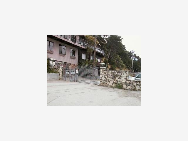 a picture of a bench in front of a building