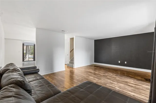 a view of livingroom with furniture and window