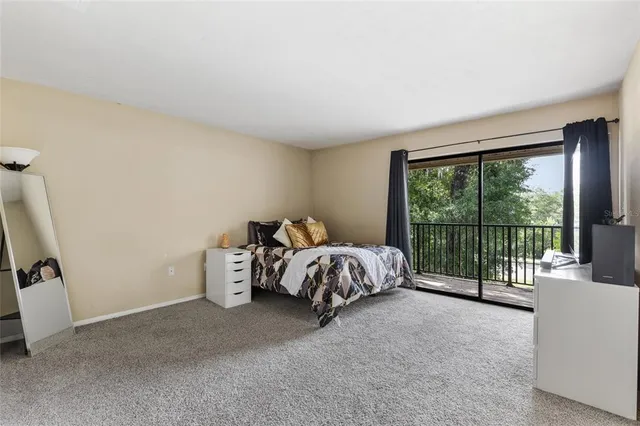 a bed sitting in a room next to a window