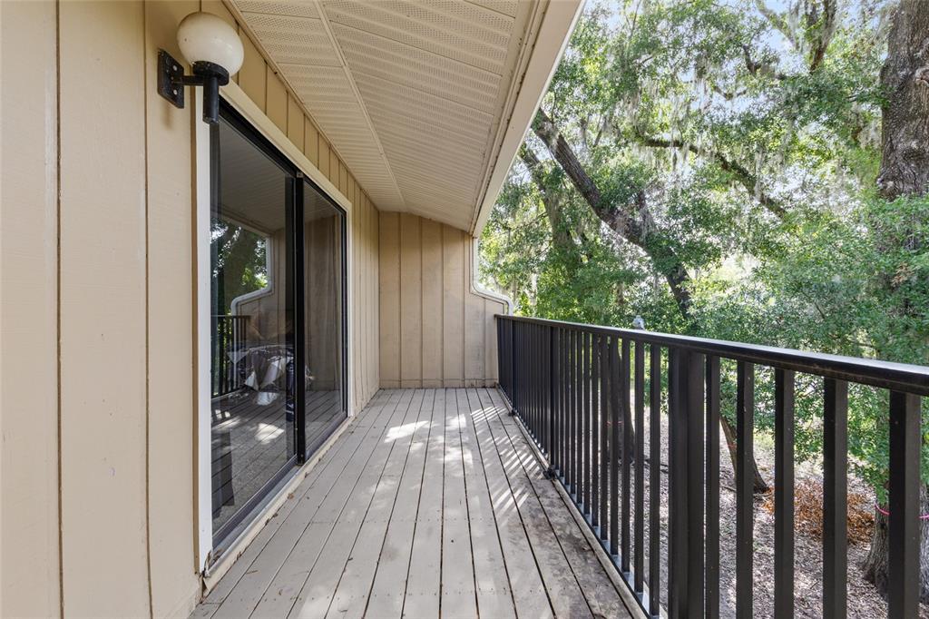 507 Northwest 39th Road, Unit 320 Gainesville, FL 32607 - Photo 26 of 33 a view of balcony with wooden floor