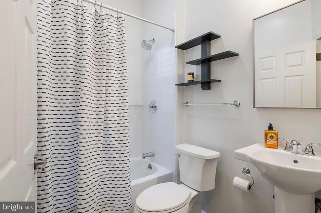 a bathroom with a toilet and a sink