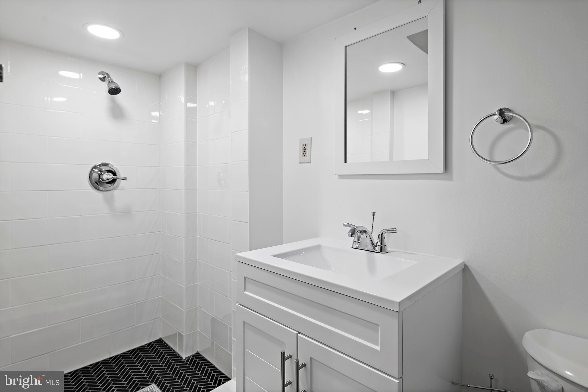 55 S Street Northwest Washington, DC 20001 - Photo 20 of 25 a bathroom with a sink toilet and a mirror