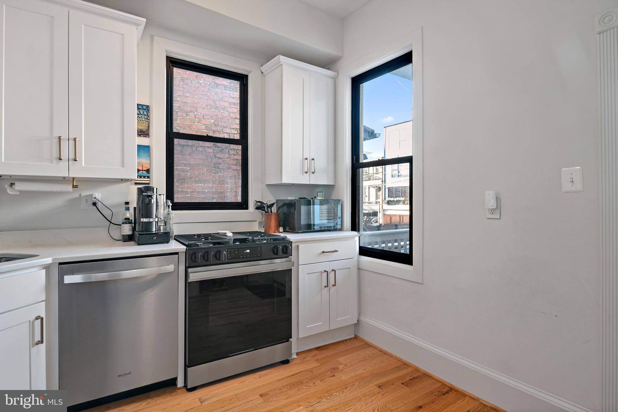 55 S Street Northwest Washington, DC 20001 - Photo 7 of 25 a kitchen with a stove and a sink