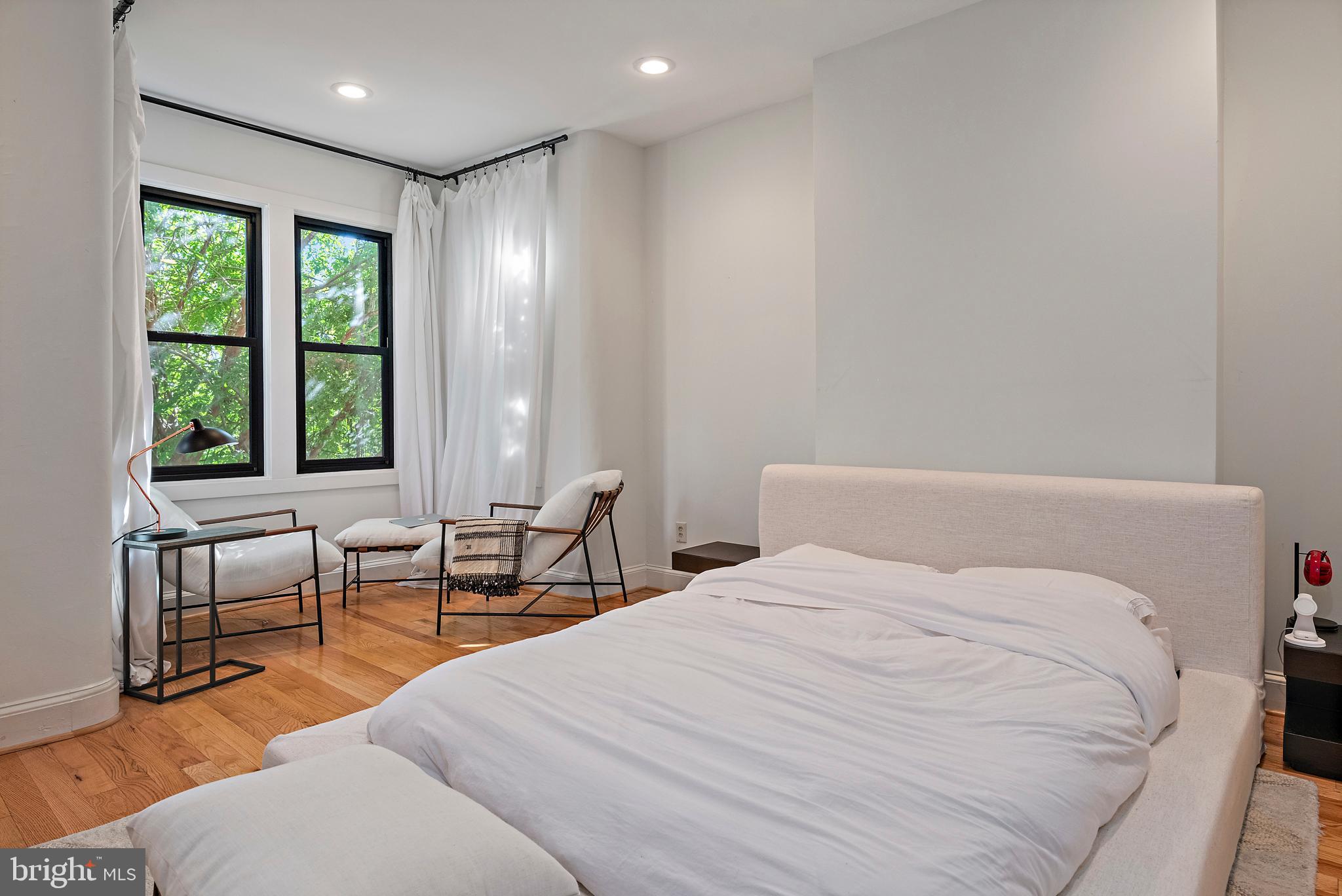 55 S Street Northwest Washington, DC 20001 - Photo 9 of 25 a bedroom with a bed and a large window