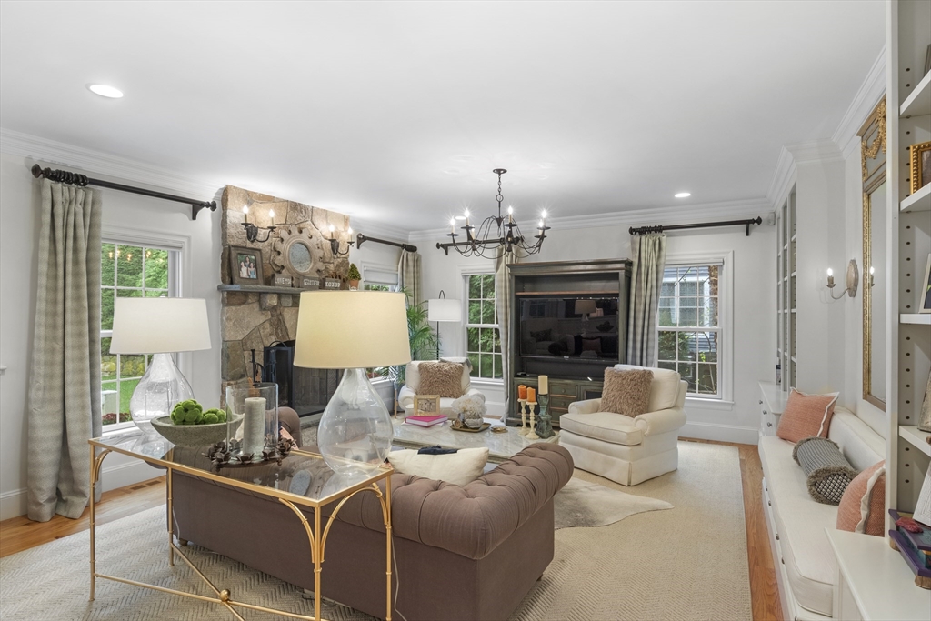 38 Longacre Road Needham, MA 02492 - Photo 15 of 42 a living room with furniture and a fireplace