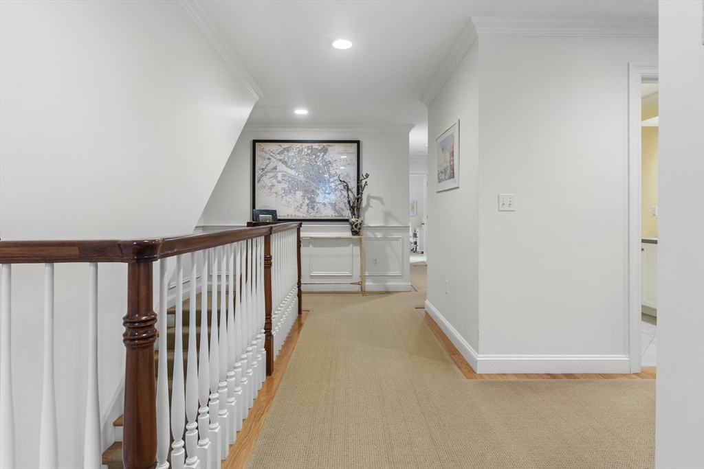38 Longacre Road Needham, MA 02492 - Photo 25 of 42 a view of a hallway with wooden floor and staircase