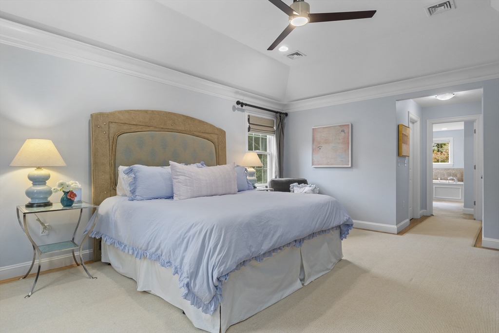 38 Longacre Road Needham, MA 02492 - Photo 26 of 42 a bedroom with a bed and a chandelier