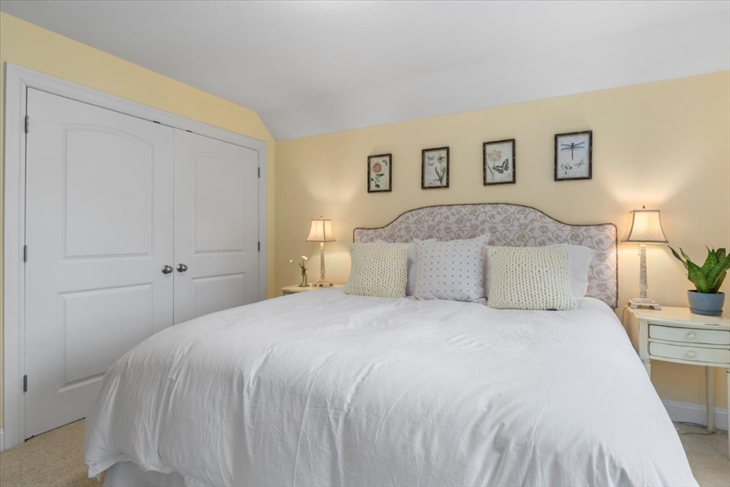 38 Longacre Road Needham, MA 02492 - Photo 30 of 42 a bedroom with a bed and a night stand