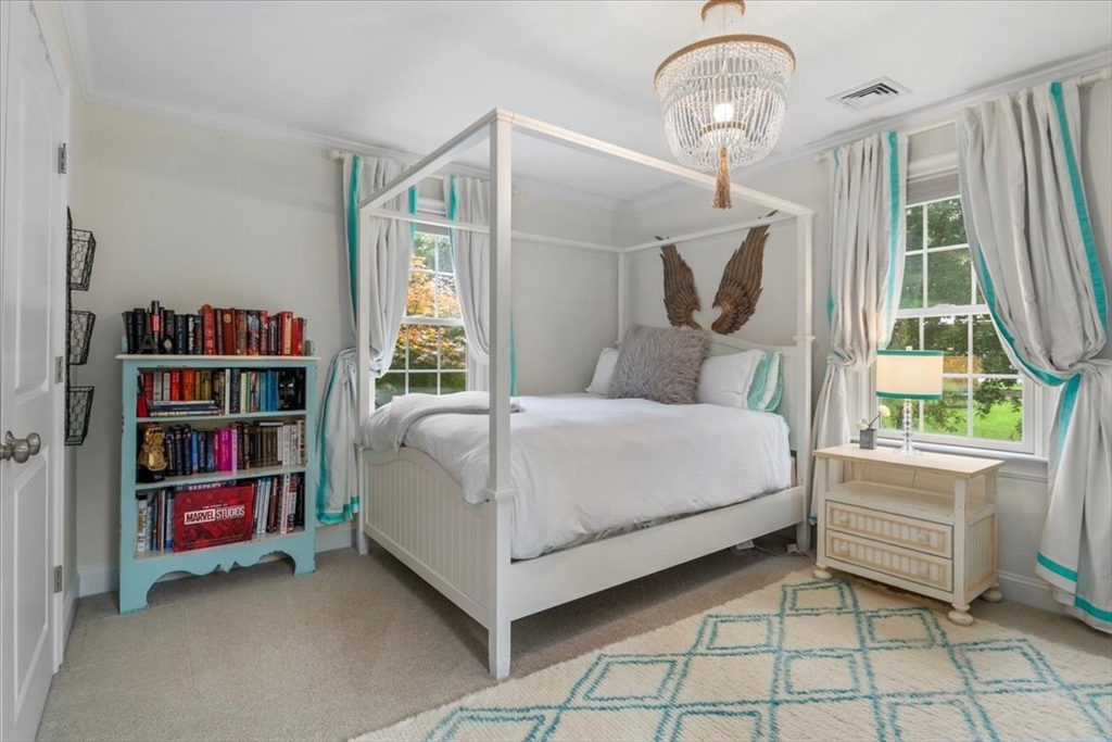 38 Longacre Road Needham, MA 02492 - Photo 31 of 42 a bedroom with a bed and a book shelf