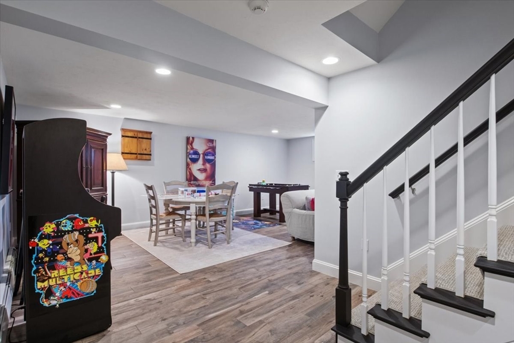 38 Longacre Road Needham, MA 02492 - Photo 35 of 42 a living room with furniture and a flat screen tv