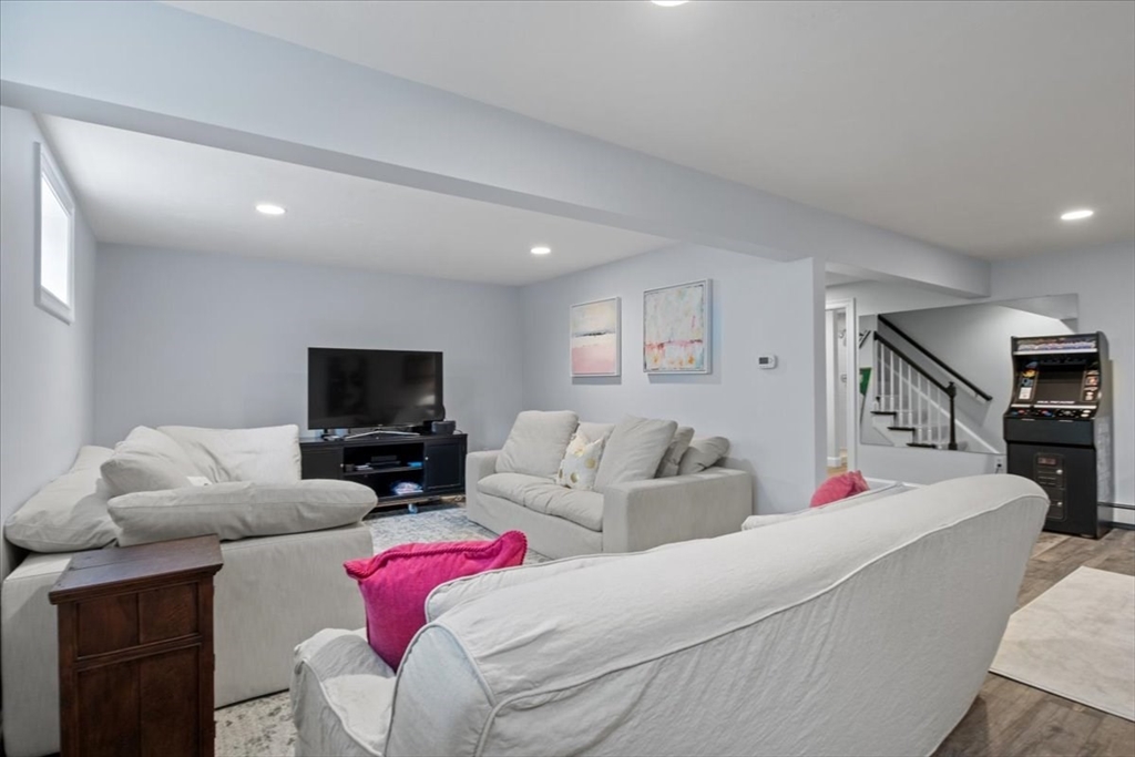 38 Longacre Road Needham, MA 02492 - Photo 36 of 42 a living room with furniture and a flat screen tv