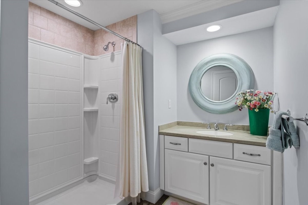 38 Longacre Road Needham, MA 02492 - Photo 37 of 42 a bathroom with a granite countertop sink mirror vanity and toilet