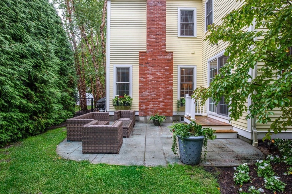 38 Longacre Road Needham, MA 02492 - Photo 40 of 42 a view of a house with a yard and a garden