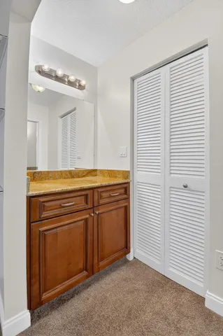a kitchen with a cabinets and white stove