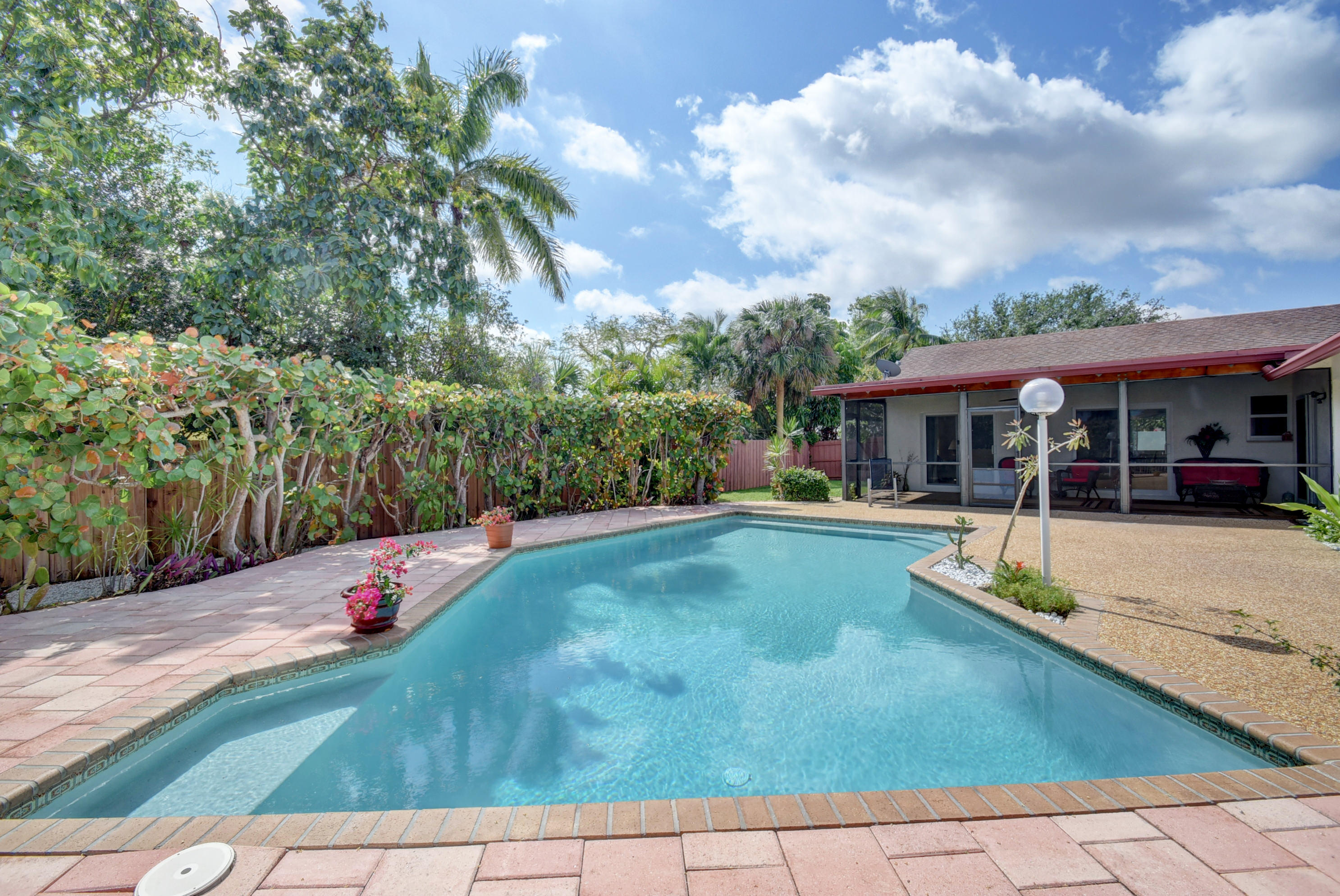 1113 Southwest 17th Street Boca Raton, FL 33486 - Photo 32 of 41 Beautiful and Tropical Backyard