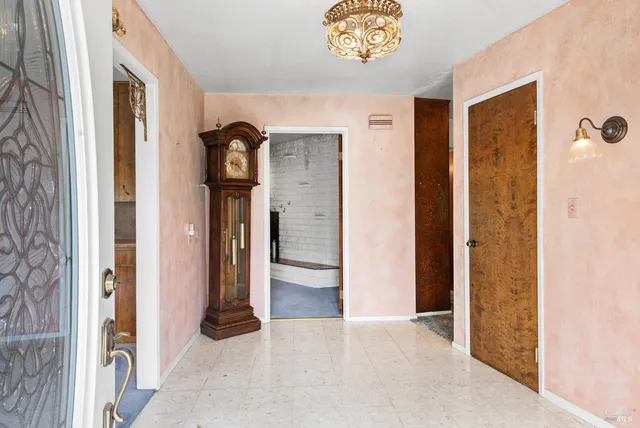 a view of an empty room with a cabinet