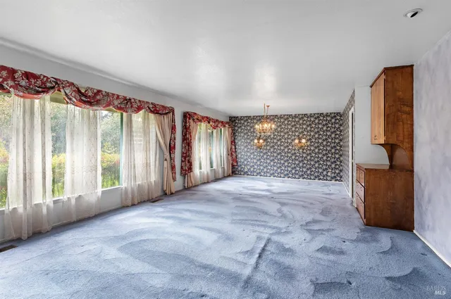 a bathroom with a sink a light fixture and a mirror