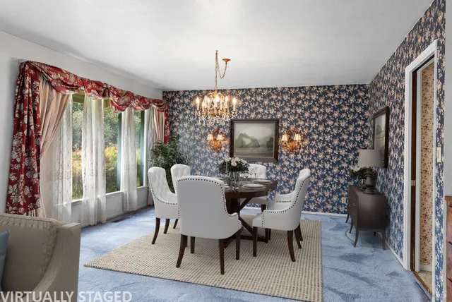 a view of a livingroom with a ceiling fan and window