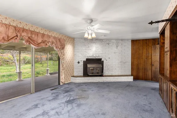 a view of an empty room with a cabinet
