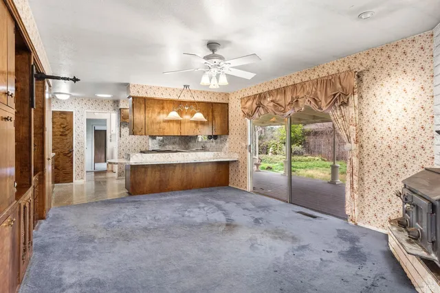 a bathroom with a granite countertop sink and a bathtub