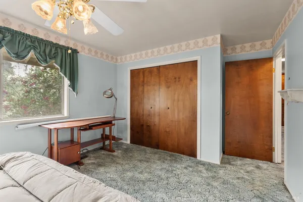 a bathroom with a sink and a washing machine with double vanity