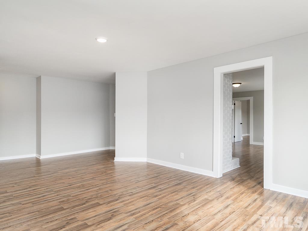 1235 South Main Street Graham, NC 27253 - Photo 14 of 33 a view of wooden floor and windows in a room